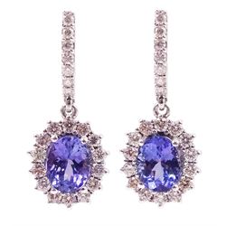 Pair of 14ct white gold oval tanzanite and round brilliant cut diamond cluster, pendant stud earrings, stamped 585, total tanzanite weight approx 2.80 carat, total diamond weight approx 1.15 carat