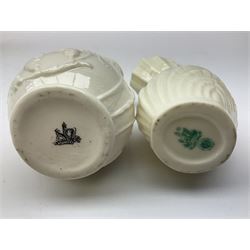Quantity of Belleek ceramics to include mid-late 19th century jug moulded with green man mask and foliage, date code stamp for 1863-1890, together with later Belleek cornucopia shape vase, jug and other vases together with a Belleek style shell dish raised on branches, tallest H19cm