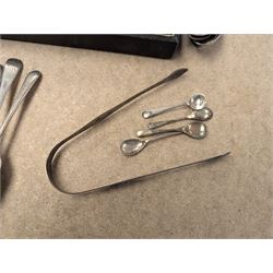 Group of silver, comprising mustard pots, open salts, napkin ring, spoons, sugar tongs and fruit knife, all stamped or hallmarked 