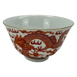 Chinese porcelain iron red tea bowl, the exterior painted with two five claw dragons chasing the flaming pearl, amidst clouds, red Quinlong seal mark beneath, D10.5cm x H6.5cm