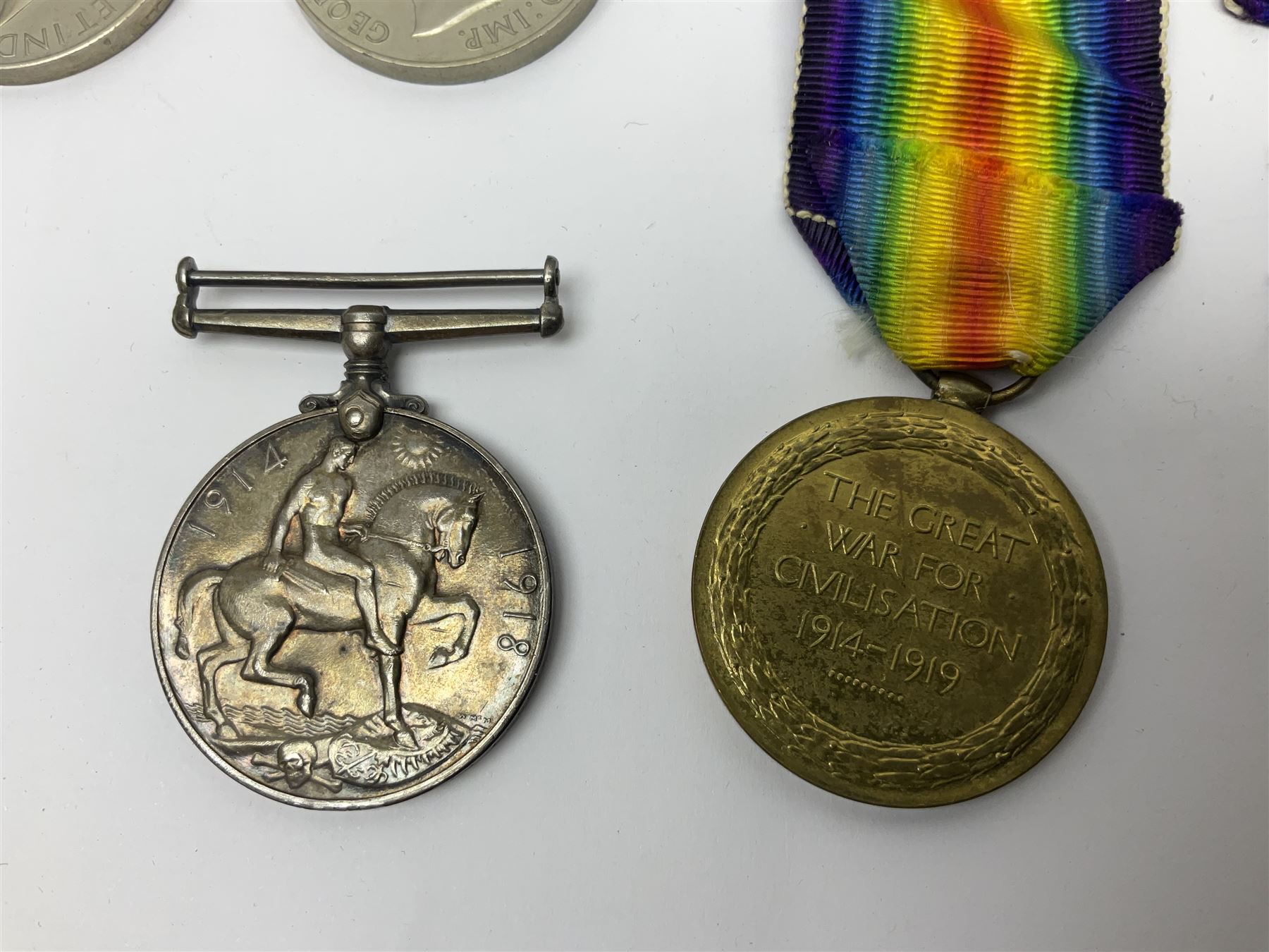WWI pair of medals comprising British War Medal and Victory Medal awarded to 380807 Pte. W. Hayles Hamps. R.; Imperial Service Medal awarded to William Hayles; cased and boxed; WWII 1939-1945 War Medal and Defence Medal in issue box with slip; 1930s hallmarked silver football presentation fob etc