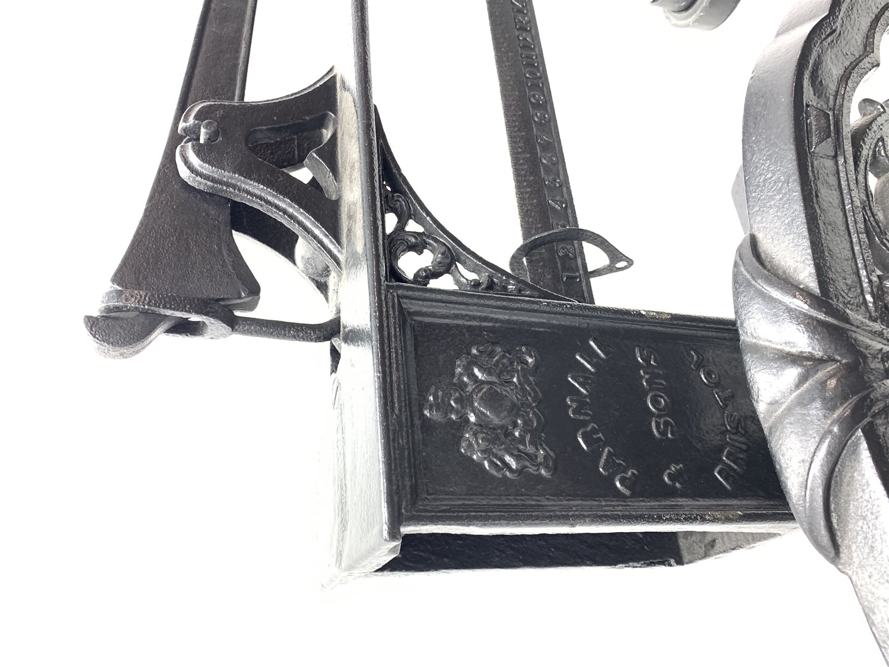 19th century platform scales by Parnall & Sons. Bristol, black painted cast iron, raised back decorated with foliage scrolls and fruit garland, H128cm