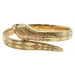 9ct gold hinged snake bangle, with garnet set eyes, makers mark FM (possibly Fred Manshaw Ltd), London 1958