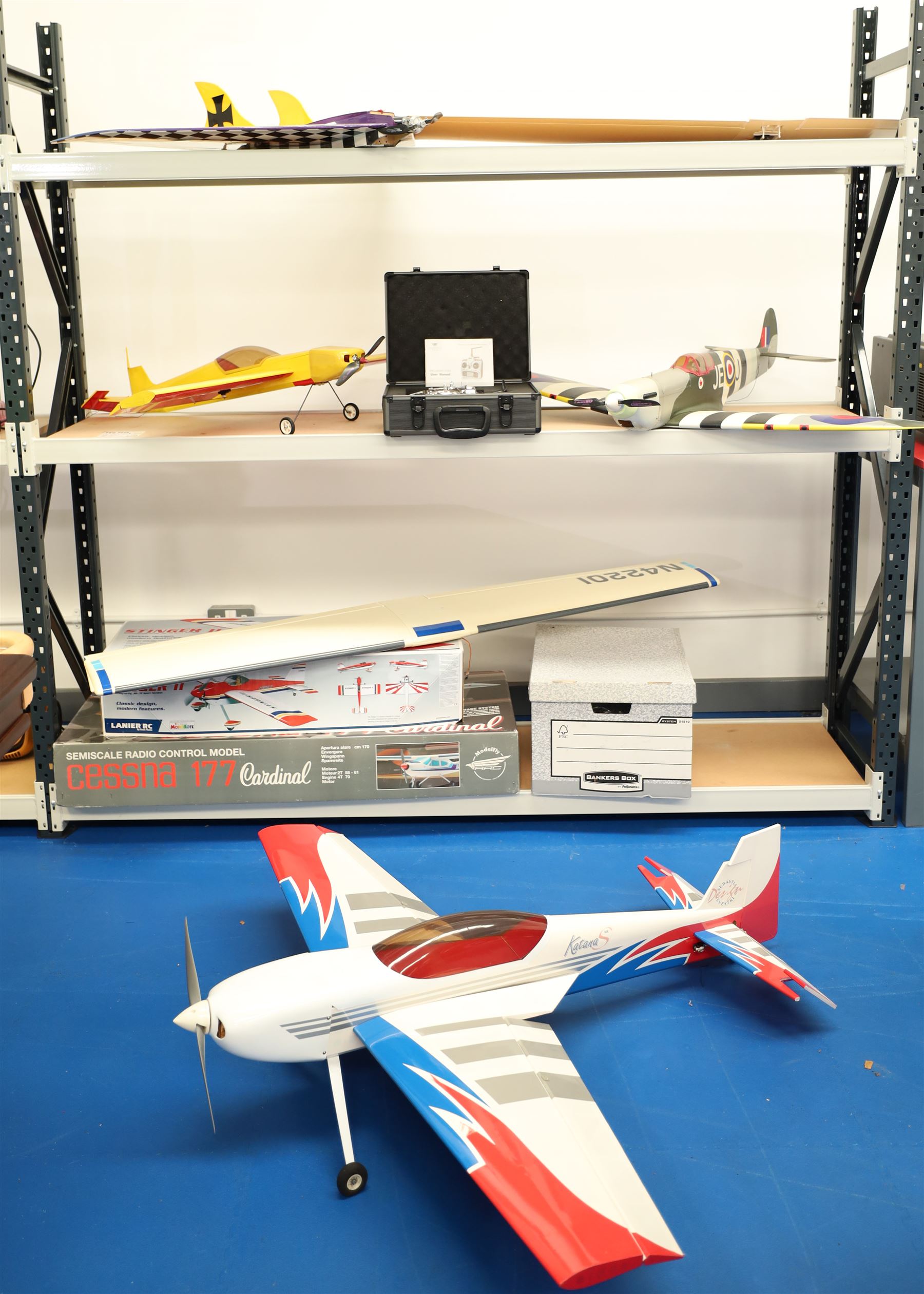 A collection of Remote control airplanes and helicopters; comprising four airplane built models, Walkera WK-2801 Pro transmitter boxed in a flight case, miscellaneous small RC helicopter parts and transmitters 