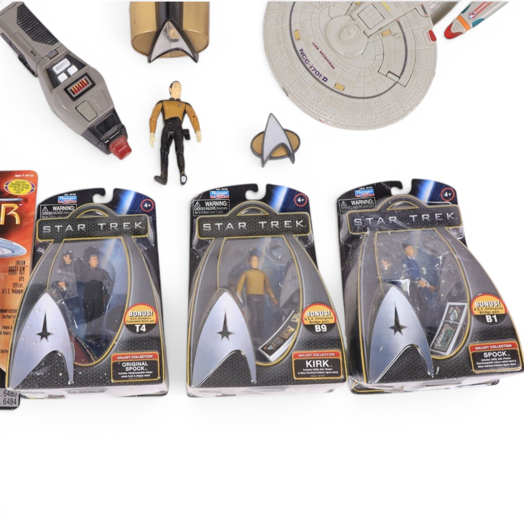Four carded Playmates Star Trek figures, comprising Ensign Harry Kim, Galaxy Collection Kirk, Original Spock and Spock, together with a small collection of loose Star Trek models and star ships