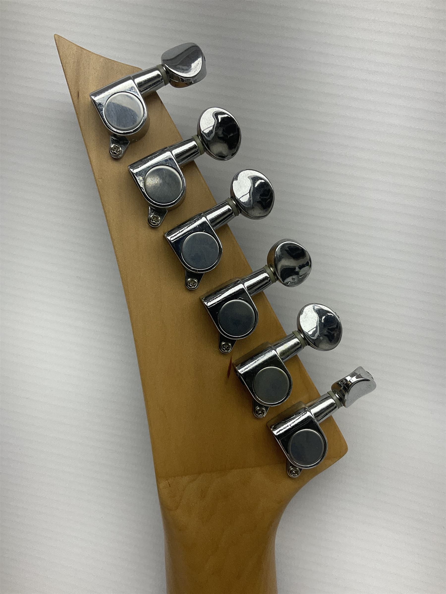 Jaxville X-Factor six-string electric guitar with three-tone X-shaped body L116cm overall.