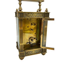 French - Matching pair of Edwardian 8-day timepiece carriage clocks with bevelled rectangular glass panels and overlaid friezes in gilt repousse work with fretted dial masks,  circular enamel chapter ring with Arabic numerals and steel spade hands, both clocks with single train movements, one movement with a jewelled cylinder platform escapement and the other with a jewelled and silvered lever platform escapement.
No Keys.