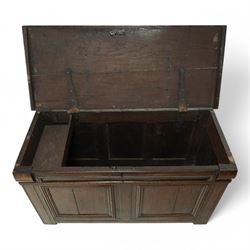 18th century oak blanket chest, chamfered rectangular hinged top over panelled front and sides, decorated with applied mouldings, on stile supports