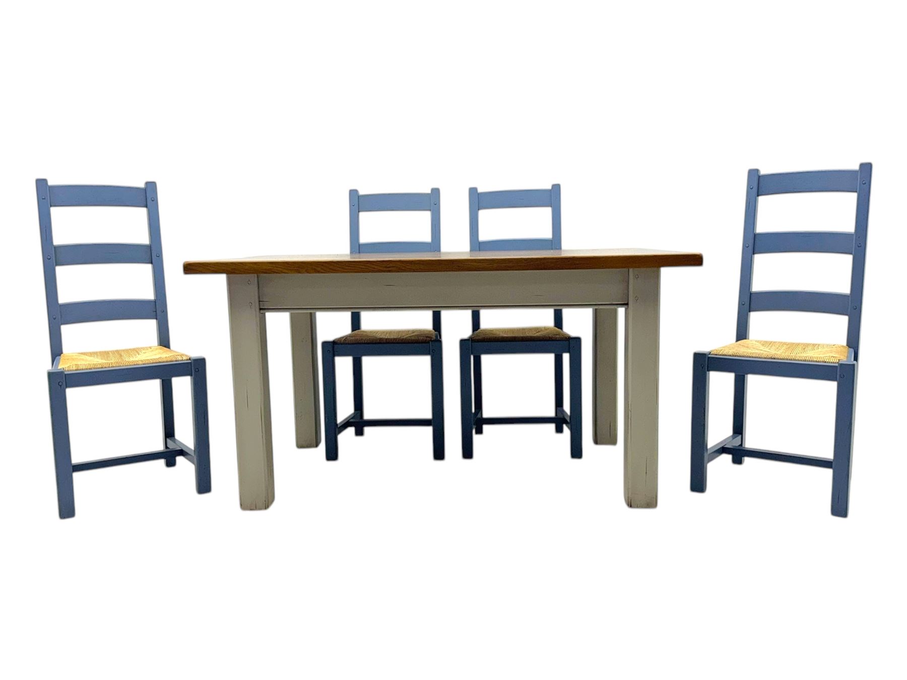 Fired Earth - contemporary kitchen table, rectangular oak parquetry top over four cream painted chamfered square section supports; together with set of four ladderback chairs, each with woven rush seat and lavender-grey painted finish