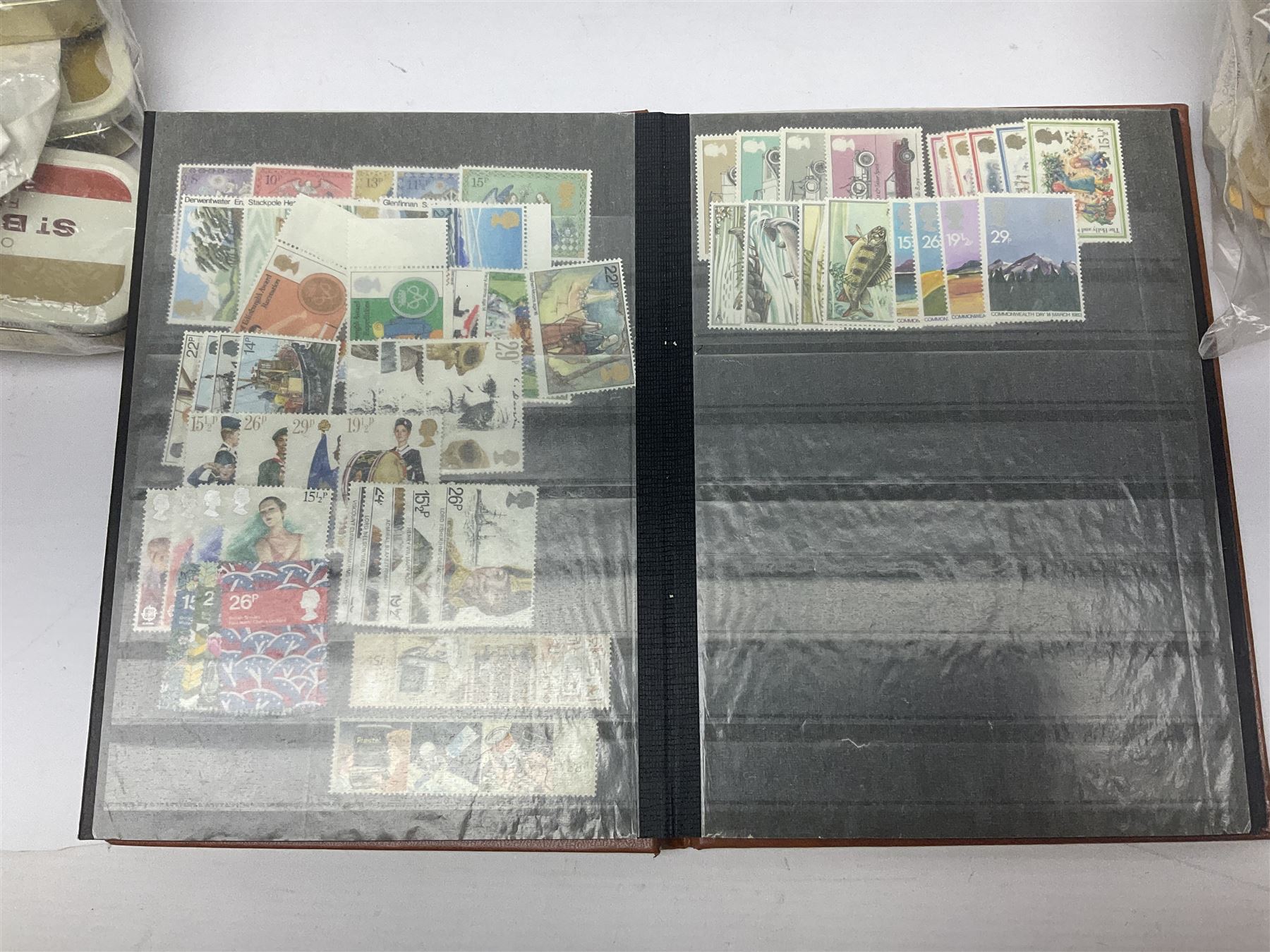 Mostly Queen Elizabeth II Great Britain and Isle of Man stamps including mint examples, housed in various albums, stockbooks and loose, in one box