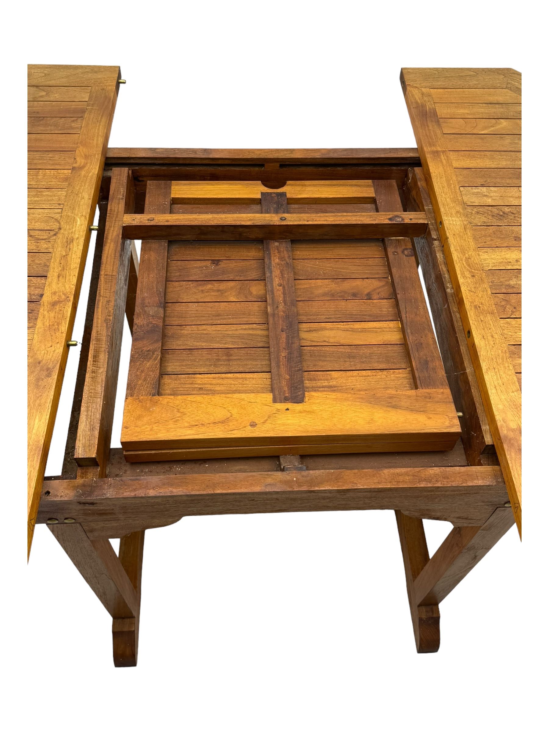 Extendable garden table, octagonal slatted top with central hinged folding leaf, on straight rectangular supports connected by double stretcher