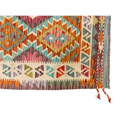 Anatolian Turkish Kilim multi-colour rug, decorated with all over lozenges in contrasting colours with ivory outline, the multi-band ivory border with repeating geometric shapes and small lozenges or diamonds