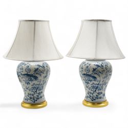 Pair of Chinese blue and white baluster form table lamps, each decorated with exotic birds...