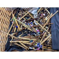 Collection of lace making wooden bobbins, together with lace making books and a handmade storage box