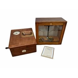 Early 20th century Gledhill-Brook mahogany cased Time Recorder, W35cm with framed receipt dated 1913 together with a cased set of balance scales by Philip Harris & Co. (2)