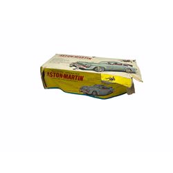 Gilbert Aoshin (Japan) James Bonds Aston Martin DB5 as seen in “Goldfinger and Thunderball” battery operated (untested) Tinplate model, silver with chrome trim, James Bond and Bandit figures, machine guns, bullet shield, ejector seat, revolving licence plate and extending tyre cutter; with part box lid only