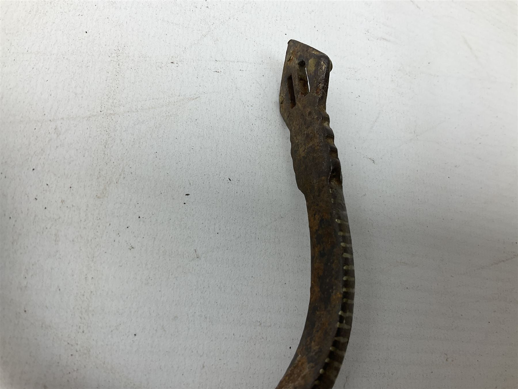 Pair of late 19th century South American iron spurs, engraved silver mounts, with sunburst rowls