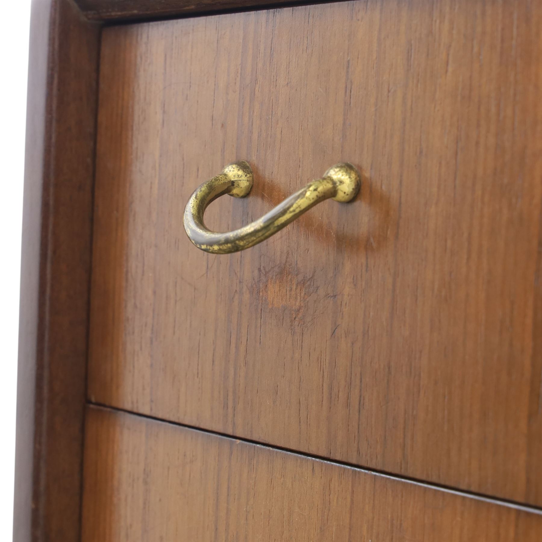G Plan - 'Librenza' tola wood chest of seven drawers, gold coloured metal pulls on an ebonised based with gold coloured feet