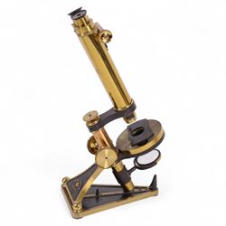 19th century brass binocular microscope by R&J Beck, London, numbered 5527, with rack and pinion focusing, with four eye pieces and three objective lenses, in wooden case