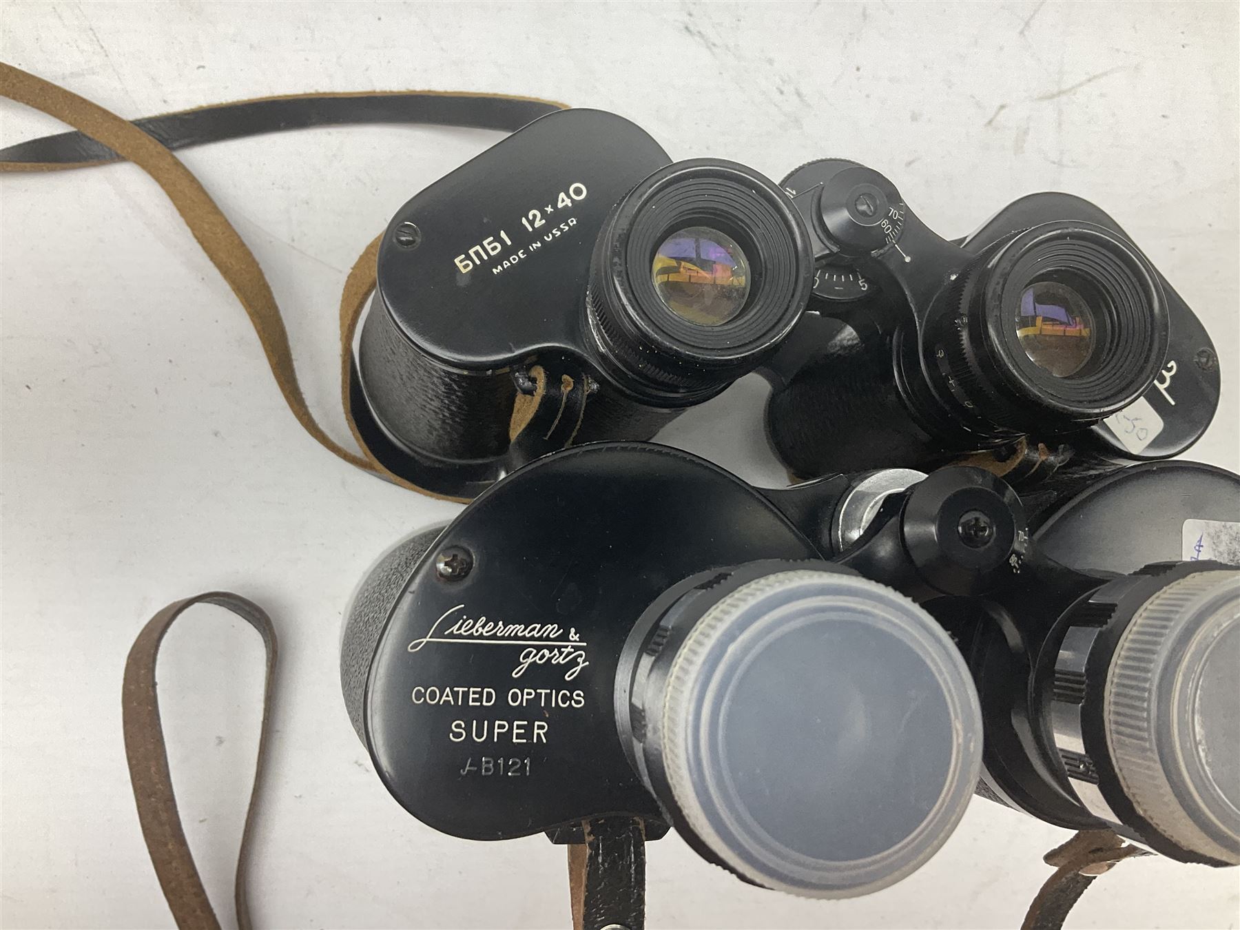 Nine cased pairs of binoculars to include Lieberman & Gortz 12x50, Frank Nipole 8x56, Uniscope, Hoya mark II 8x40, Porst 8x56 etc