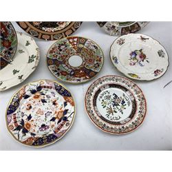 Group of 19th century plates, to include a Rockingham example with green transfer printed decoration of rose, thistle and clover springs, three Mason's examples including one decorated in the Imari palette, a Davenport example also decorated in the Imari palette, etc. 