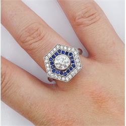 Platinum milgrain set diamond and sapphire hexagonal ring, the principle diamond of approx 0.55 carat, with sapphire and round brilliant cut diamonds, hallmarked