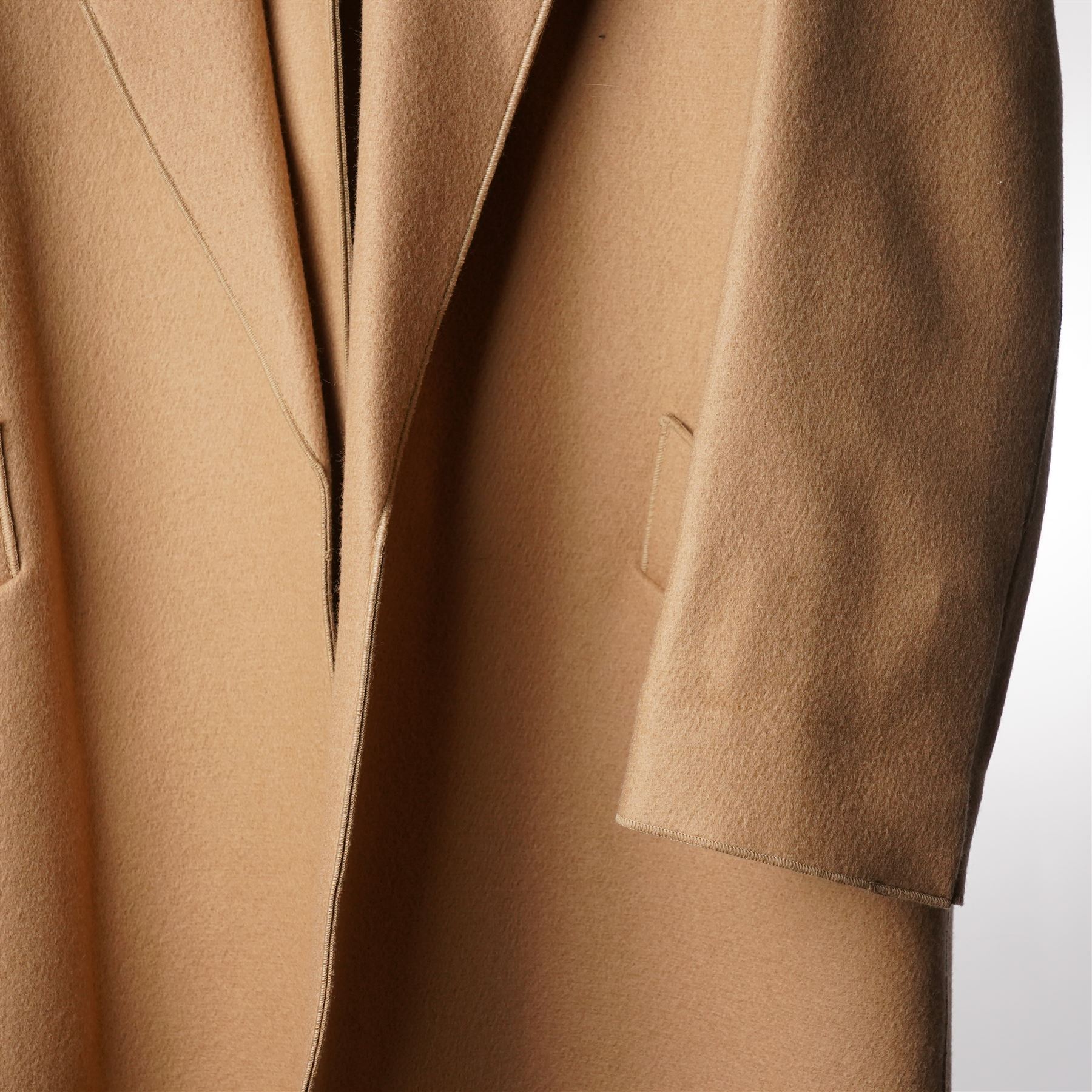 Amanda Wakeley London - full-length coat in camel wool, with notched lapels, concealed front fastening, self-tie belt, and side slip pockets, of minimalist tailored form, from the 'Petite Chic' line, unused