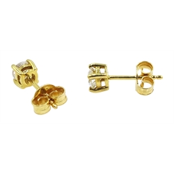 Pair of 18ct gold diamond stud earrings, stamped 750, total diamond weight 0.64 carat