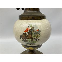 Oil lamp with ceramic reservoir printed with a hunting scene, large brass oil lamp raised on three legs with floral detail and three other oil lamps, tallest example H45cm, in two boxes 