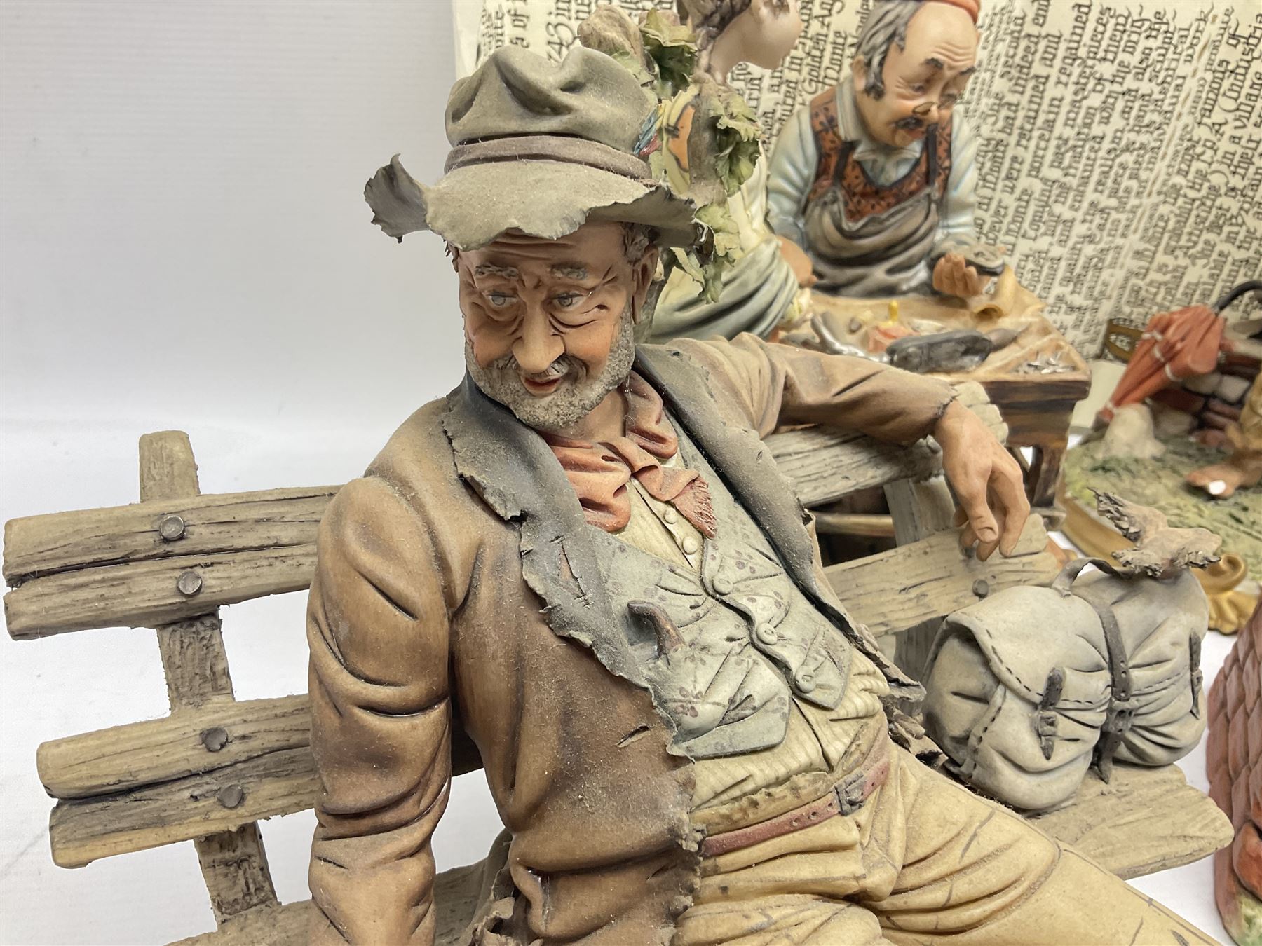 Four Capodimonte figure groups, to include tramp figures, shoemaker figure etc
