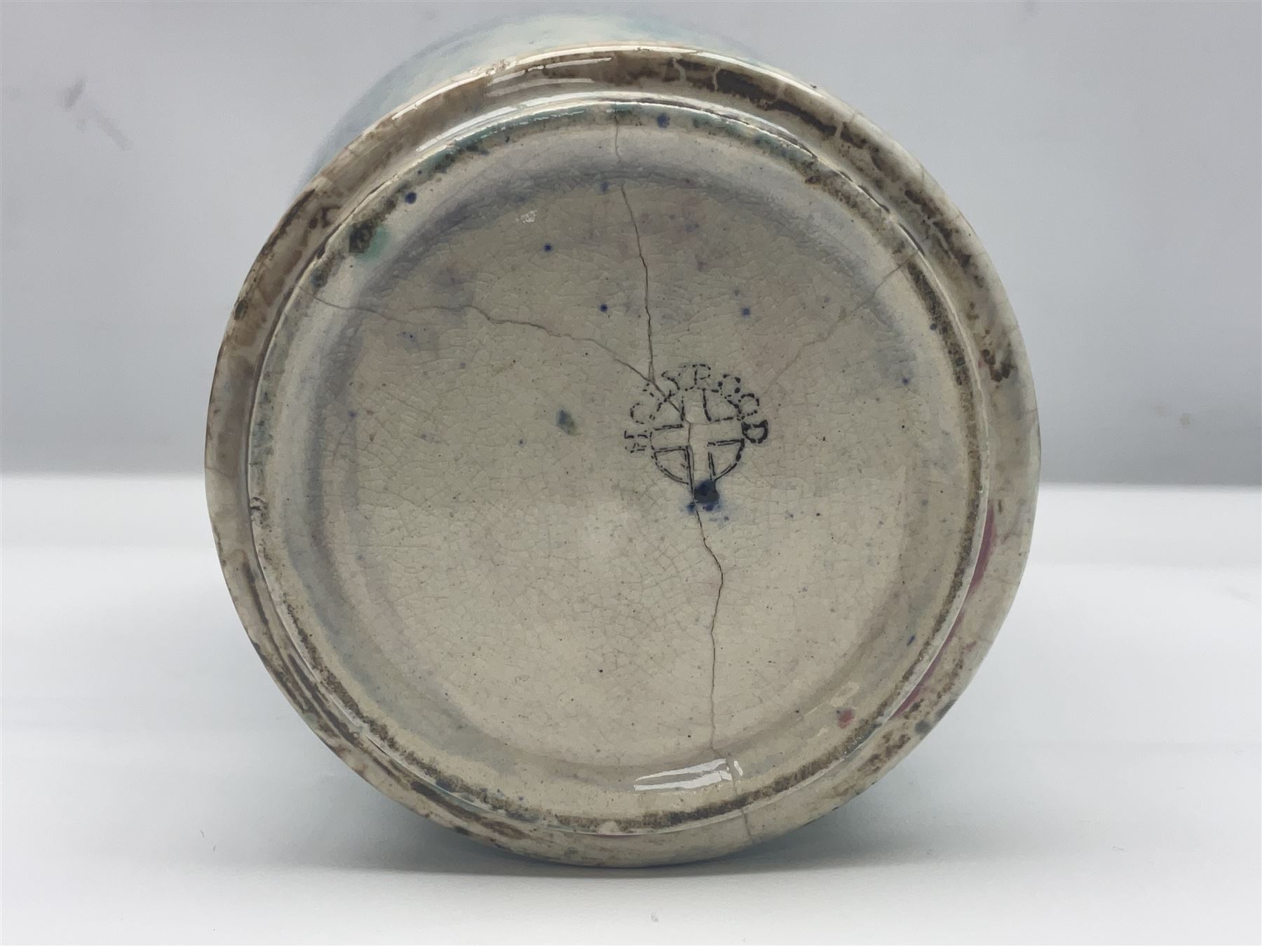 Holyrood Pottery vase of bulbous form decorated in a mottled and streaked green and blue glaze, with printed mark beneath, H24cm