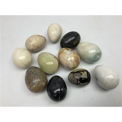 Collection of approximately 11 polished hardstone and marble models of eggs, including eggs with fossil inclusions, alabaster etc