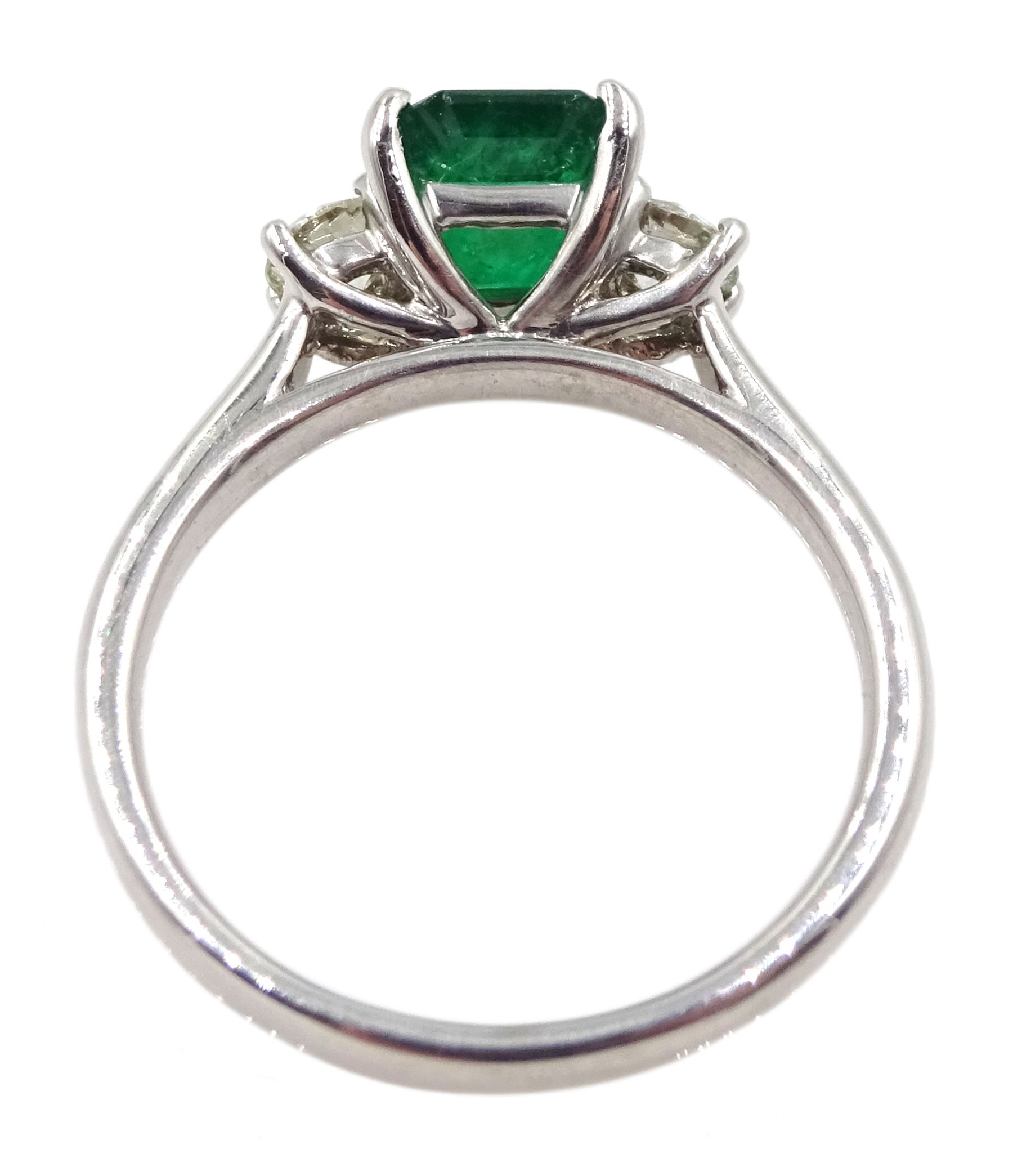 18ct white gold emerald and diamond three stone ring, hallmarked, emerald 1.16 carat, total diamond weight 0.39 carat, with World Gemological Institute Certificate 