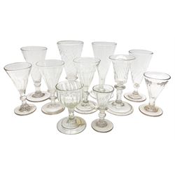 Group of 18th and 19th century drinking glasses, with wrythen twist and part fluted bowls, a number with drawn trumpet bowls, knopped stems, and three with folded feet, largest example H14cm 