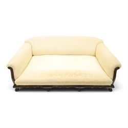Quality Edwardian carved mahogany lounge suite comprising three-seater settee and pair of armchairs, the sofa with arched back over rolled arms and deep sprung seat, the arm terminals carved with acanthus rosette over gadroon and rope-twist moulding, the shaped apron carved and moulded with scrolling foliate acanthus motifs, terminating to four large front hairy paw and ball feet, upholstered in pale yellow foliate fabric with matching seat and scatter cushions (W200cm D105cm H73cm); the matching deep armchairs (W78cm D95cm H75cm)