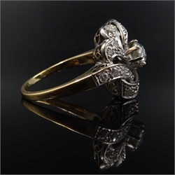  18ct gold diamond scroll ring, central old cut diamond approx 0.5 carat  
