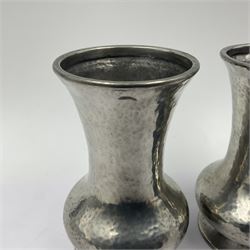 Pair of Liberty & Co Tudric pewter vases, each of bellied form with hammered finish, upon a circular spreading foot, impressed beneath 0987, H12cm