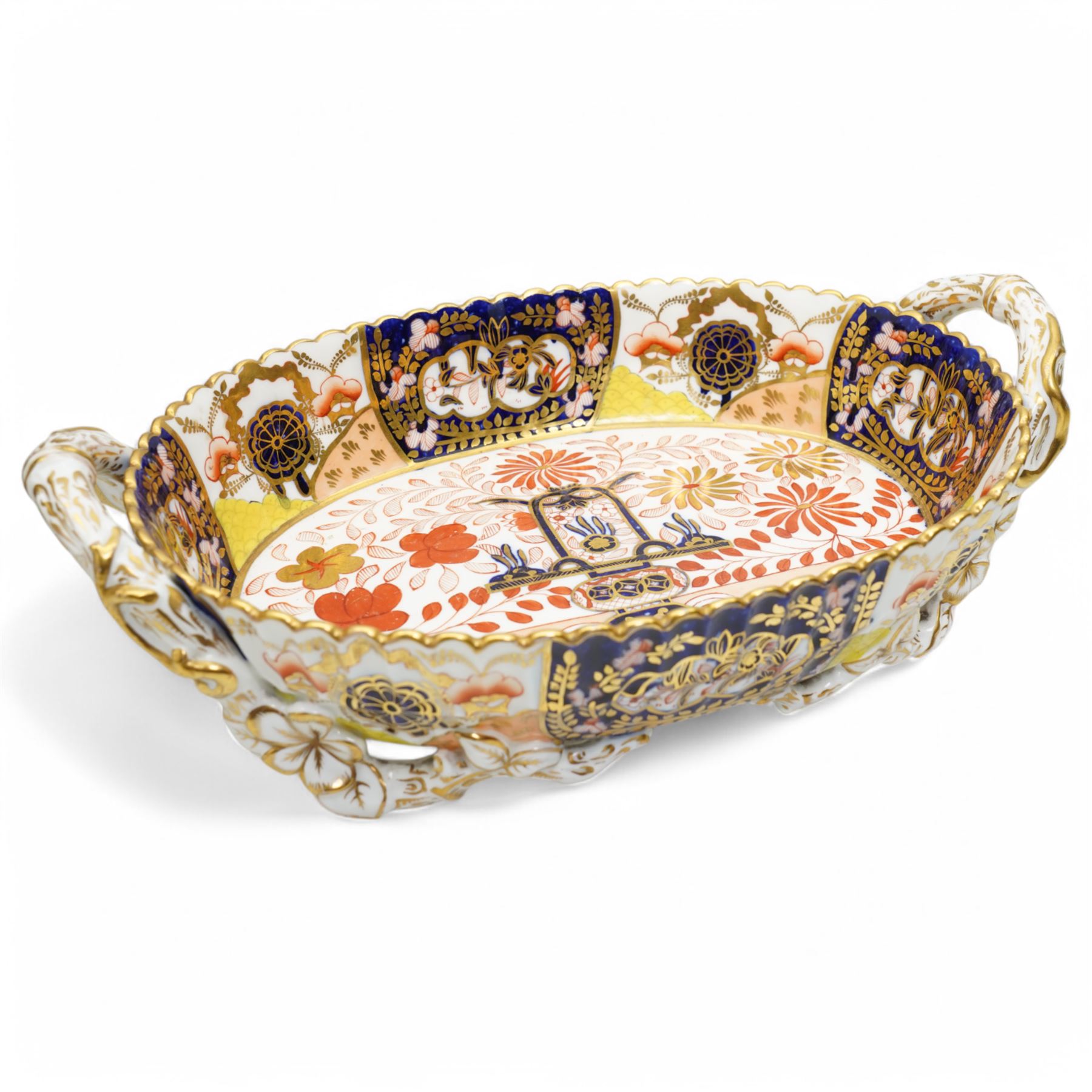 Large Victorian Copeland pedestal bowl decorated with Japanese flowers and birds, impressed mark D35cm and a Copeland two handled oval shallow dish with panels of Japanese flowers within a gilded scalloped rim, naturalistic handles and supports W30cm (2)
