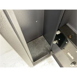 Grey steel wall mounting gun cabinet to accommodate three guns; single door with two locks with two keys for one lock; internally H128.5cm W21cm D17.5cm; externally H129cm W21.5cm D20cm