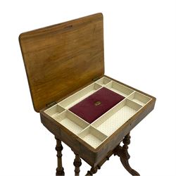 Late Victorian figured walnut sewing or work box, hinged rectangular lid inlaid with floral motifs and boxwood stringing, the interior fitted with central lidded compartment and smaller divisions, on turned pillar supports united by turned stretchers, on splayed acanthus carved feet