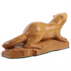 20th century walnut carvings, the first modeled as a wren, the second an otter, H  Two Yorkshire style walnut carvings, of a wren and otter, otter H10cm