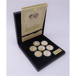  Seven Queen Elizabeth II silver proof five pound coins, six being from the 'Long to Reign Over Us' silver crown collection and a 'Sapphire Coronation Jubilee Coin', all with certificates, in a display case  