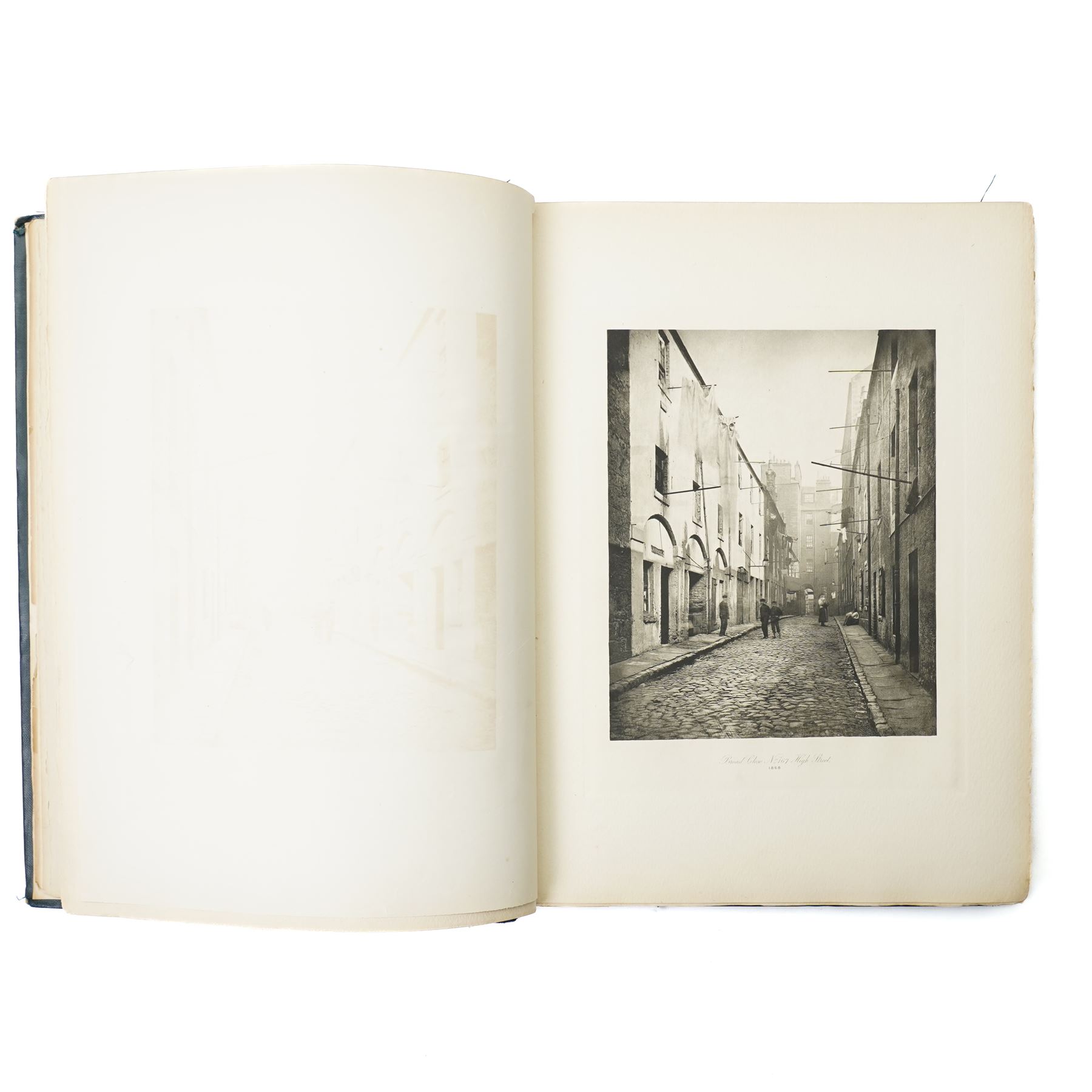 Thomas Annan (British 1829-1887) & Sons: 'Glasgow City Improvement Trust Old Closes and streets of Glasgow: A Series of Photogravures 1868-1899', folio pub. Glasgow: T. & R. Annan & Sons, 1900, folio limited to 100 copies specially printed for the corporation of Glasgow, title printed in red and black, 50 photogravure plates after Thomas Annan’s celebrated documentary photographs recording Glasgow’s wynds, closes and tenements prior to their clearance, printed on thick paper, original blue cloth gilt
