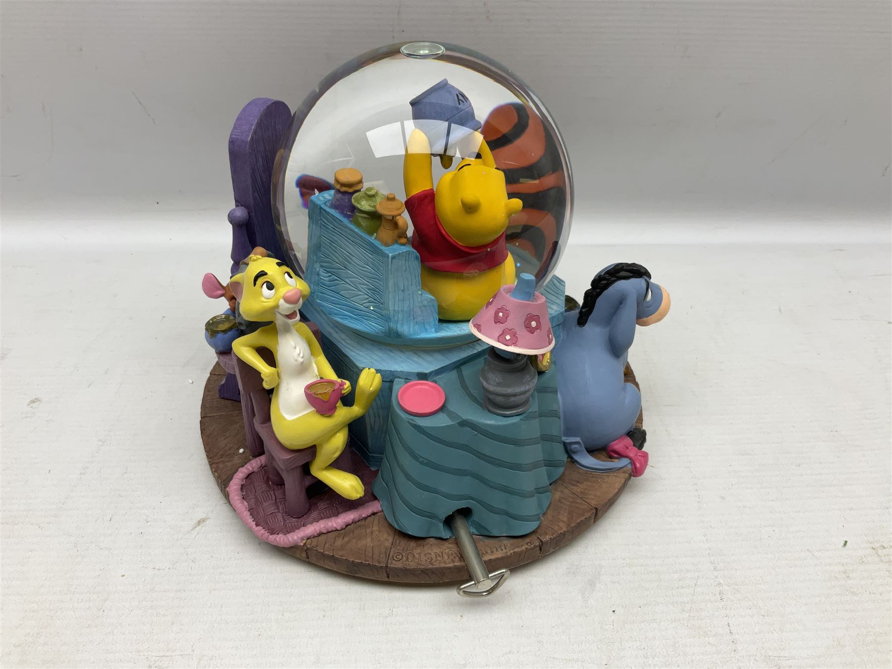 Five Disney Winnie The Pooh snow globes, to include Pooh and Piglet Sailing, Pooh's Grand Adventure and Blustery Day, together with The Walt Disney Classic Waterglobe collection globe and group Tigger, Winnie and Piglet figure under dome, all with boxes (7)