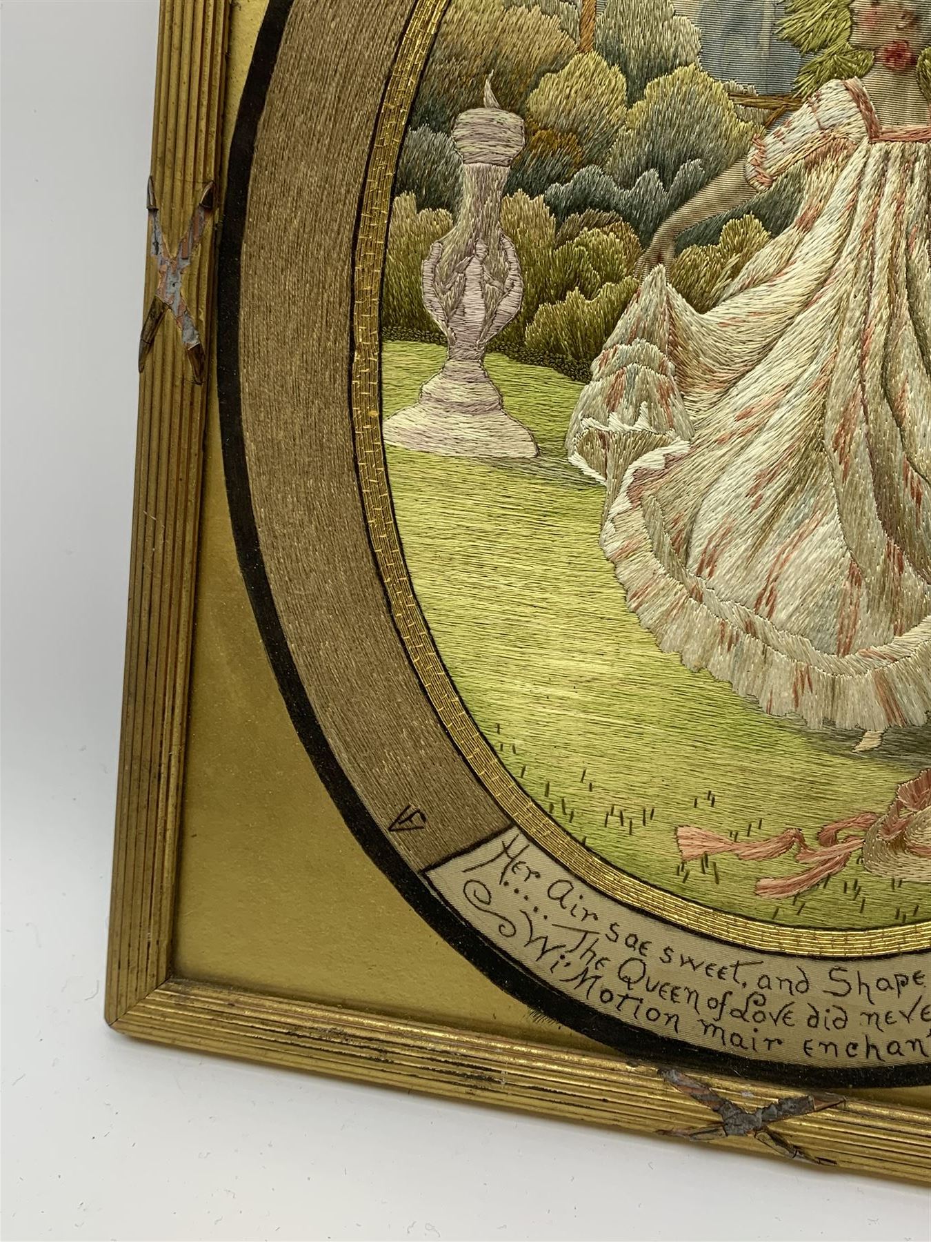 George III silkwork picture, of oval form depicting a female figure in garden setting, within a silkwork border detailed with verse from Robert Burns Bonnie Peg, 'Her air sae sweet, and shape complete, The Queen of Love did never move, Wi' Motion mair enchanting!', and monograms 'FV' and 'SM', in reeded gilt frame and gilt mount, indistinctly inscribed in pencil verso, overall H36cm L30.5cm