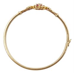 Gold cubic zirconia and pink stone set bangle