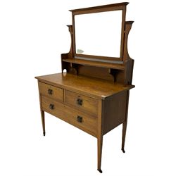 Early 20th century oak dressing chest, fitted with three drawers, swing mirror