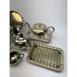 A group of assorted silver plate, to include various tea wares, three piece pierced cruet set, small candelabra, toast rack, pair of candlesticks, warming dish, etc. 