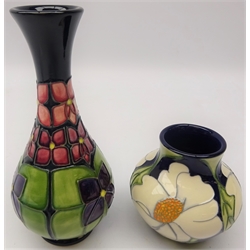  Moorcroft baluster shaped vase decorated with daisies, trial piece dated 28.11.13 and another decorated in the Violet pattern by Sally Tuffin, H17cm (2)  