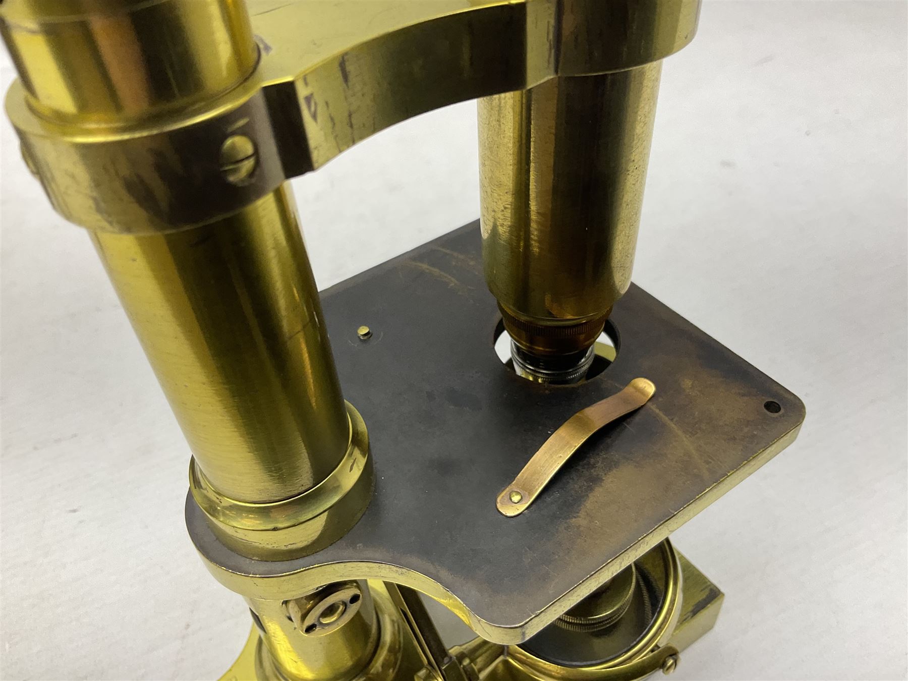 19th century brass monocular microscope by R. & J. Beck London No.18760 with hinged column and pitchfork base H25cm; in fitted mahogany case with two lenses